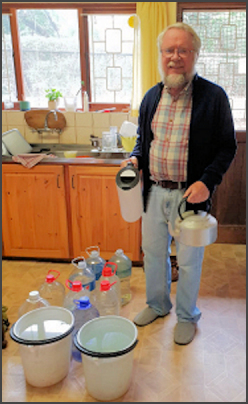 Michael with water containers